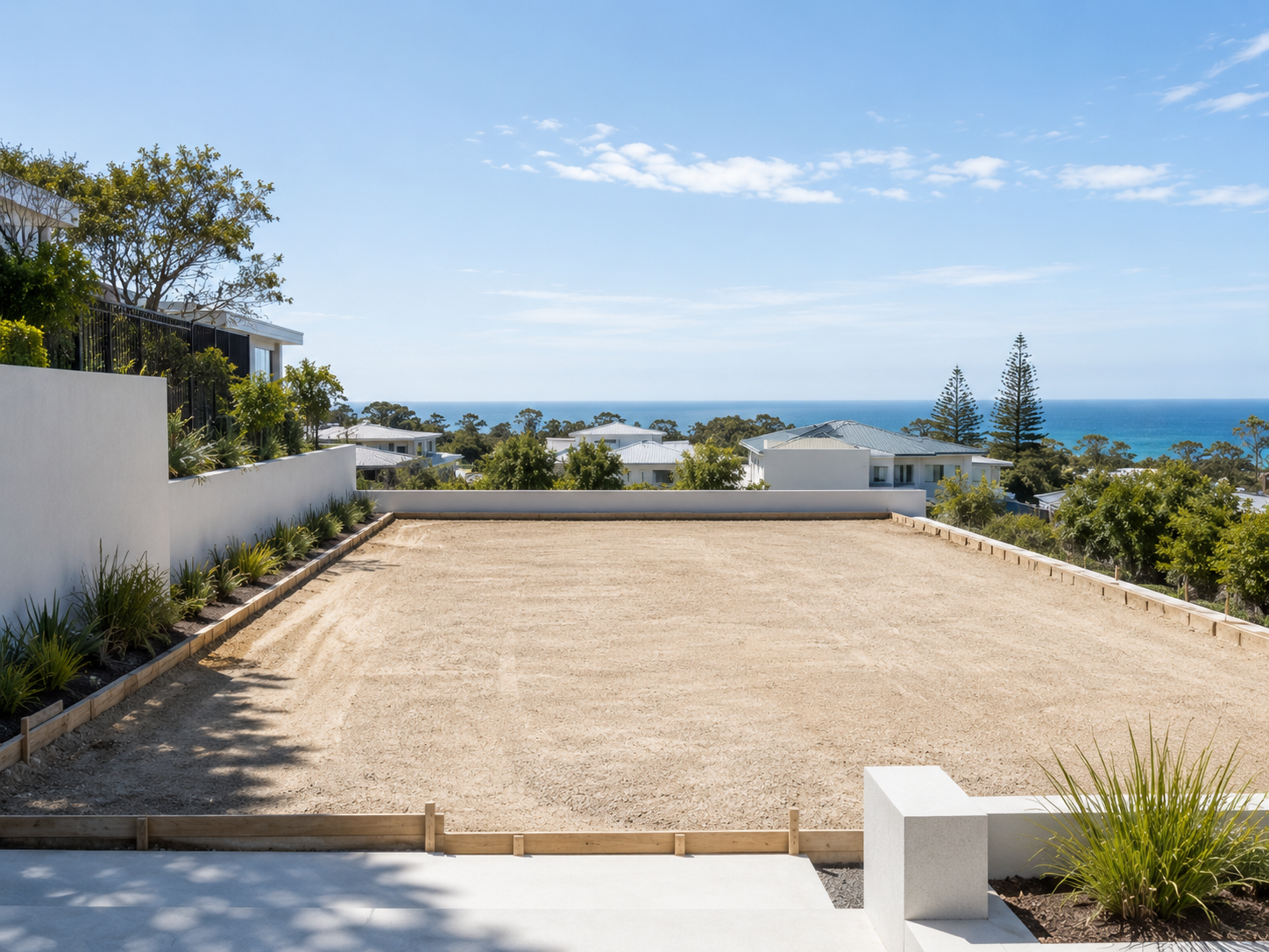 A surveyed, level building pad in daylight